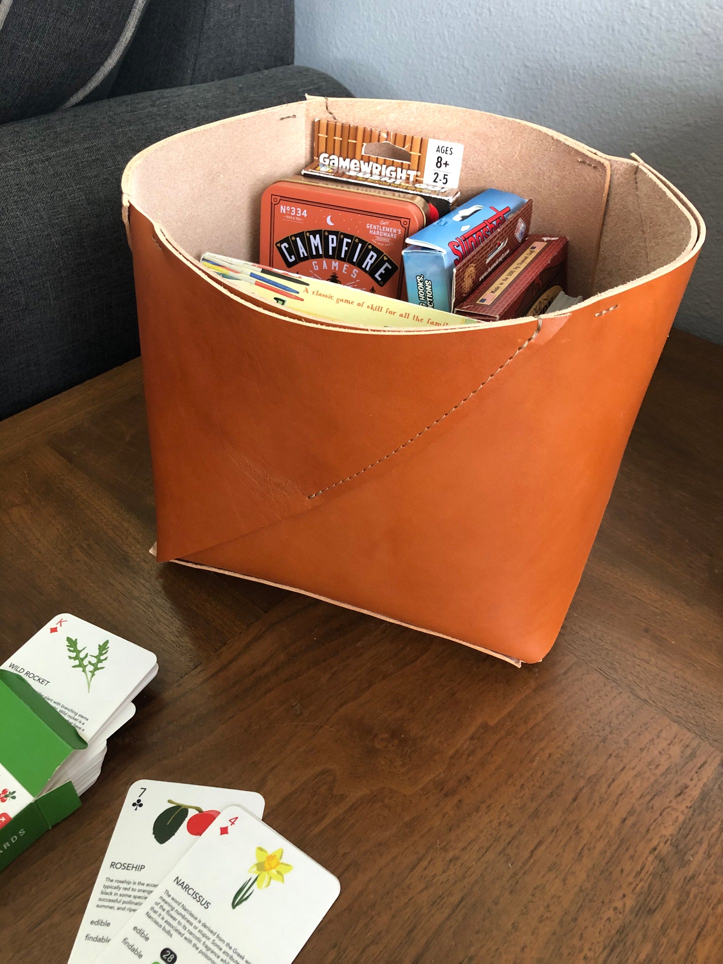 Interior view of handcrafted leather box full of games.