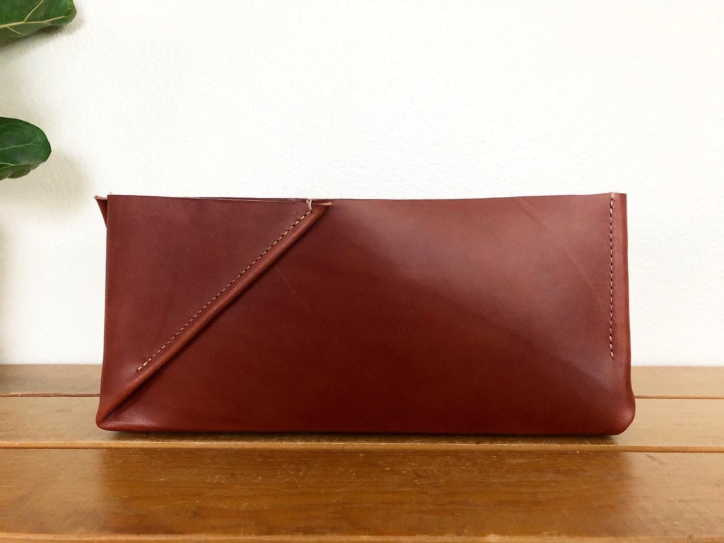 Handsome rectangular brown leather box with folded detail.