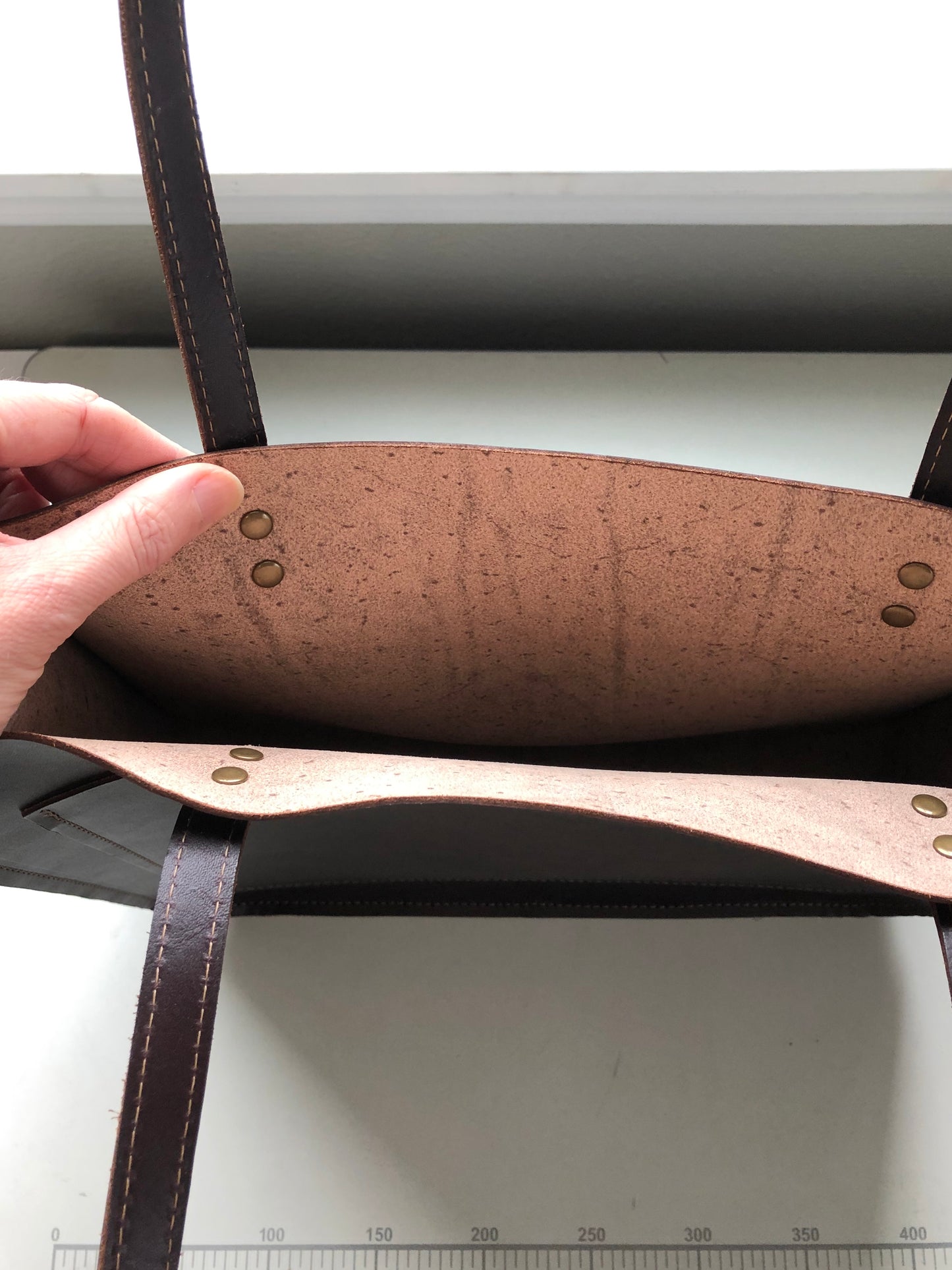 Natural leather interior of large tote bag.