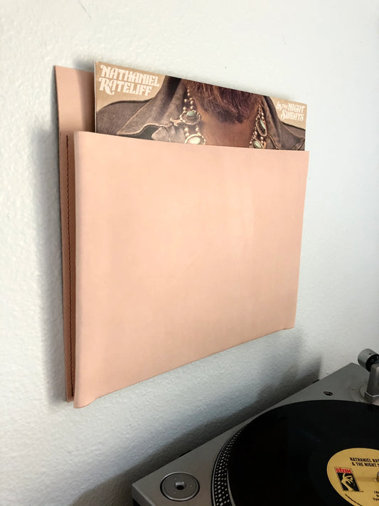 Hanging vinyl record pocket in nude leather.