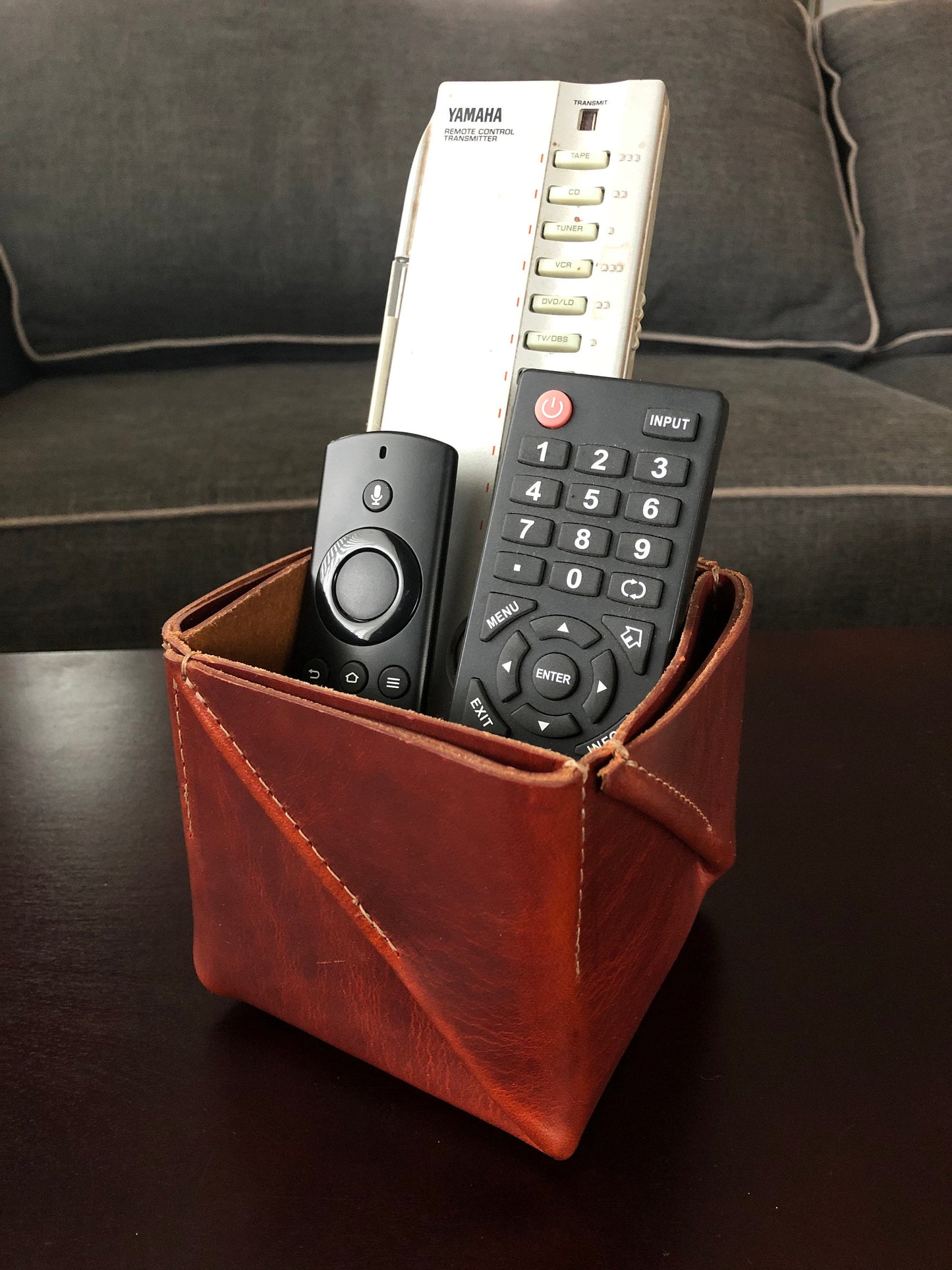 Folded leather box as remote control holder